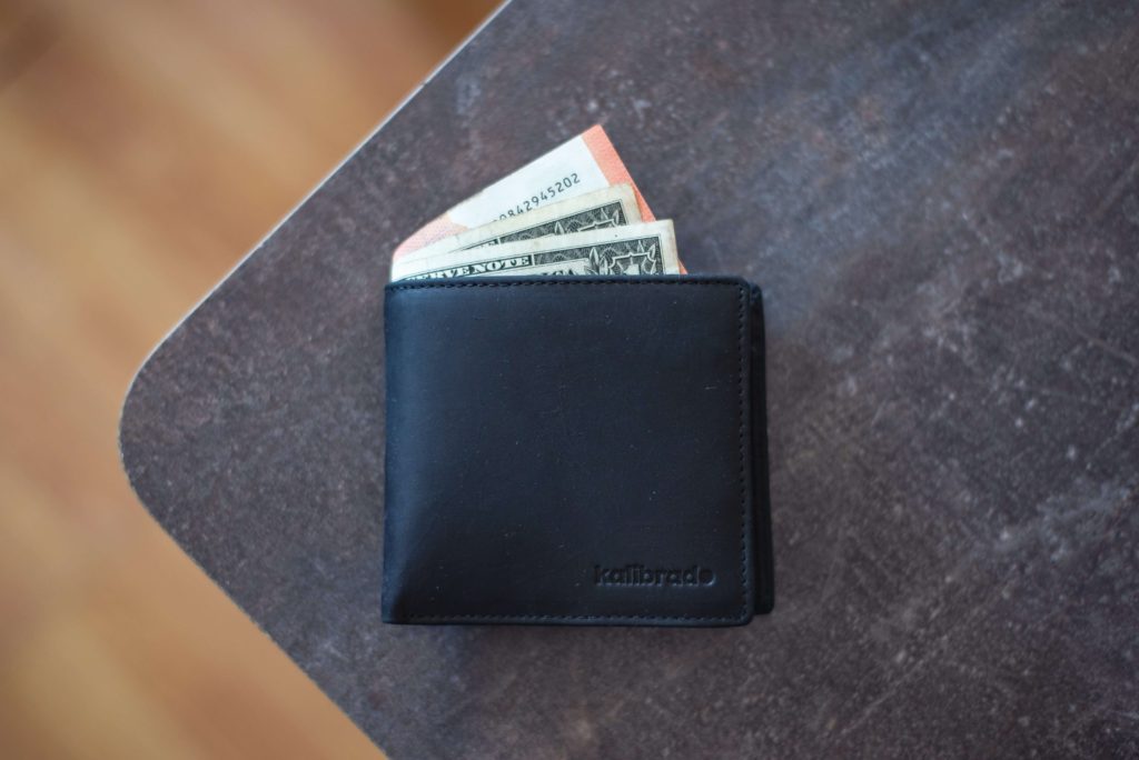 Wallet with money on a table