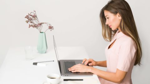 A beautiful woman working on the laptop