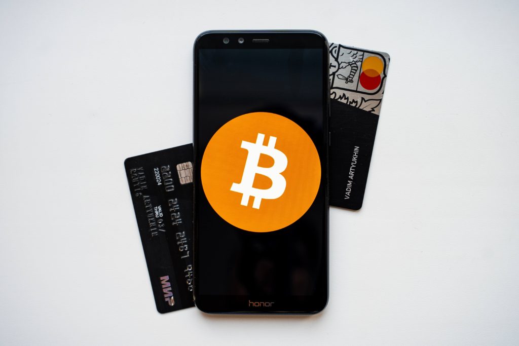 Bitcoin logo and card in display