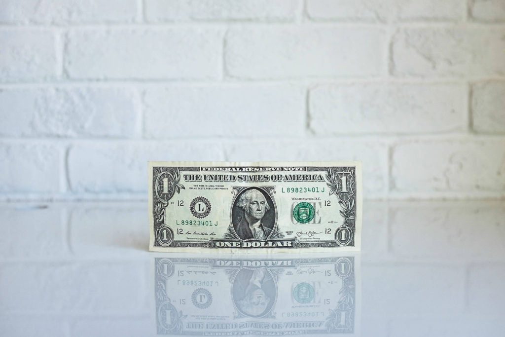 A dollar bill with a white background