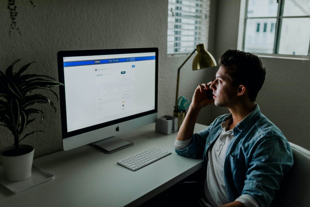 A man on the phone trying to understand social media-facebook