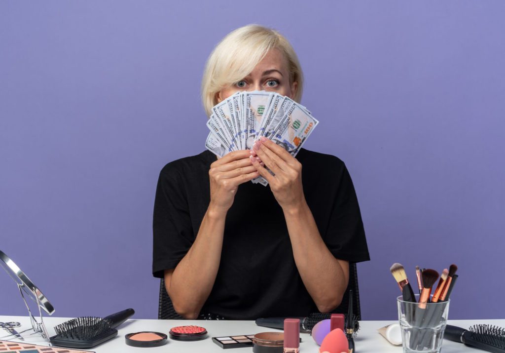 A woman showing of the loads of Cash-Cash Smasher Secrets