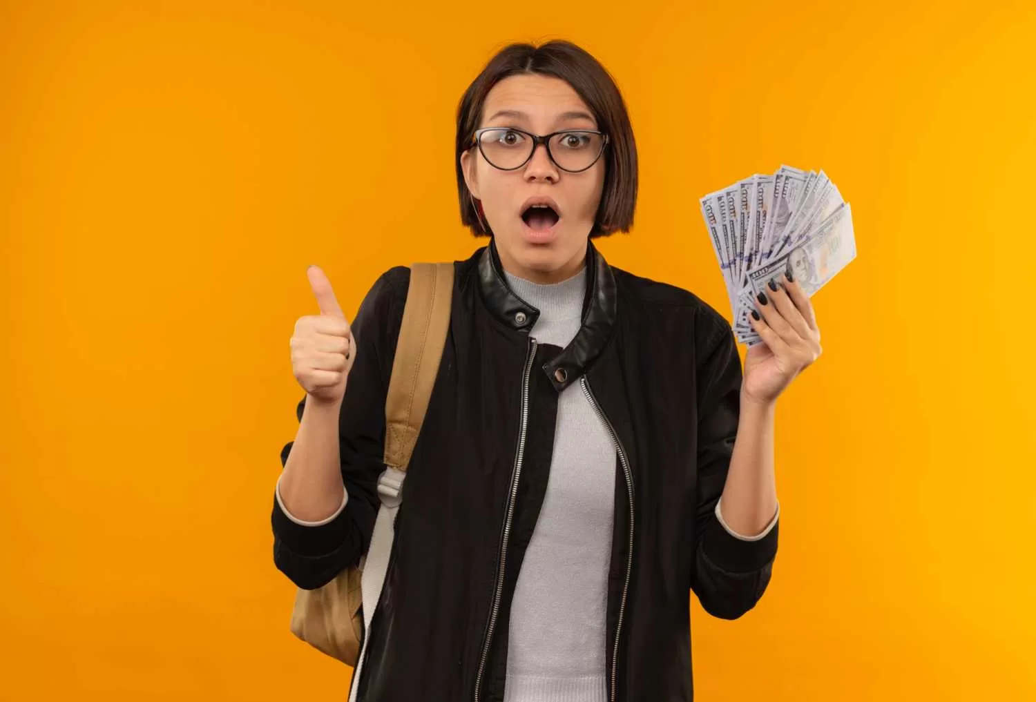 impressed student girl, glasses, backpack, holding money, thumbs up, Crypto Future, orange background